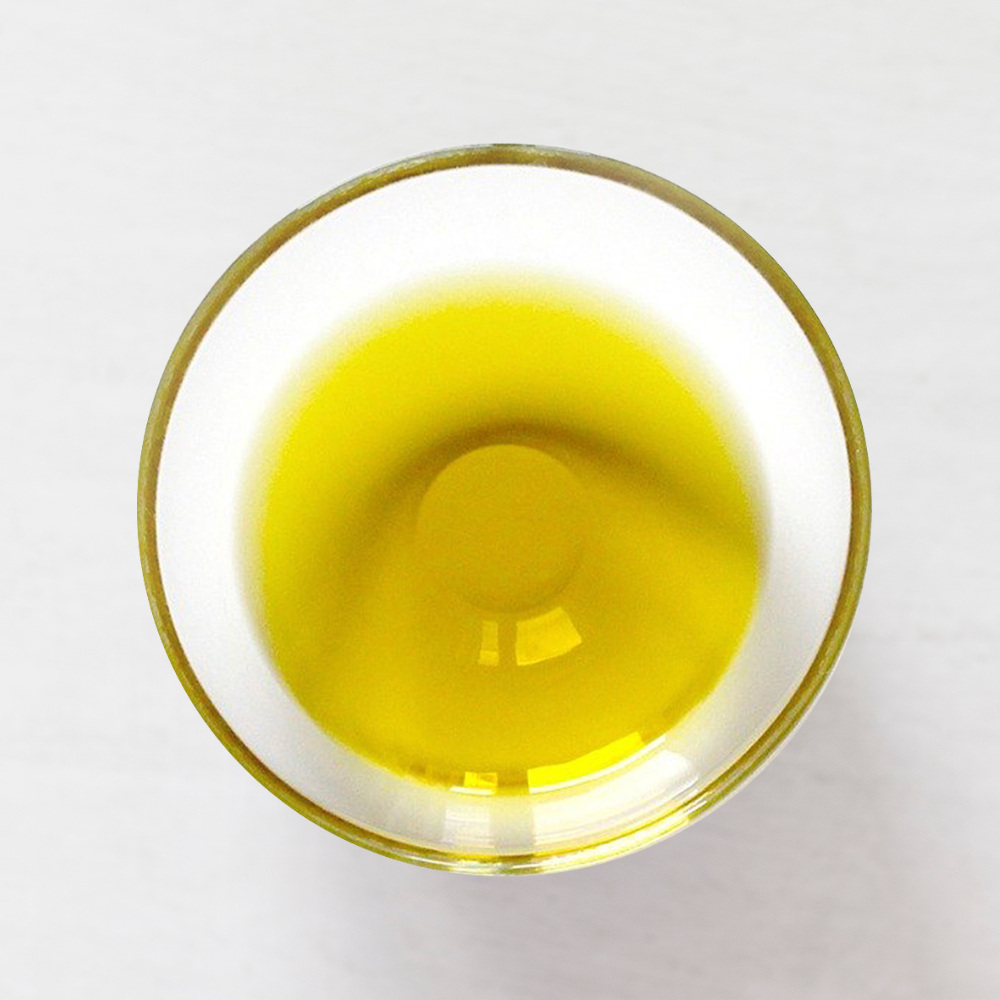 Organic, unfiltered extra virgin olive oil in a bowl