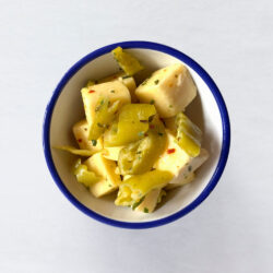 Cheddar Cheese & Macedonian Peppers in a bowl